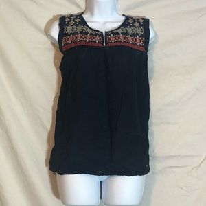 Sleeveless boho top with embroidered design